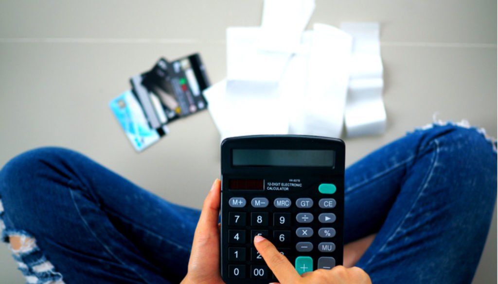 Debt person in jeans w calculator
