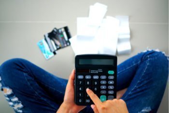 Debt person in jeans w calculator