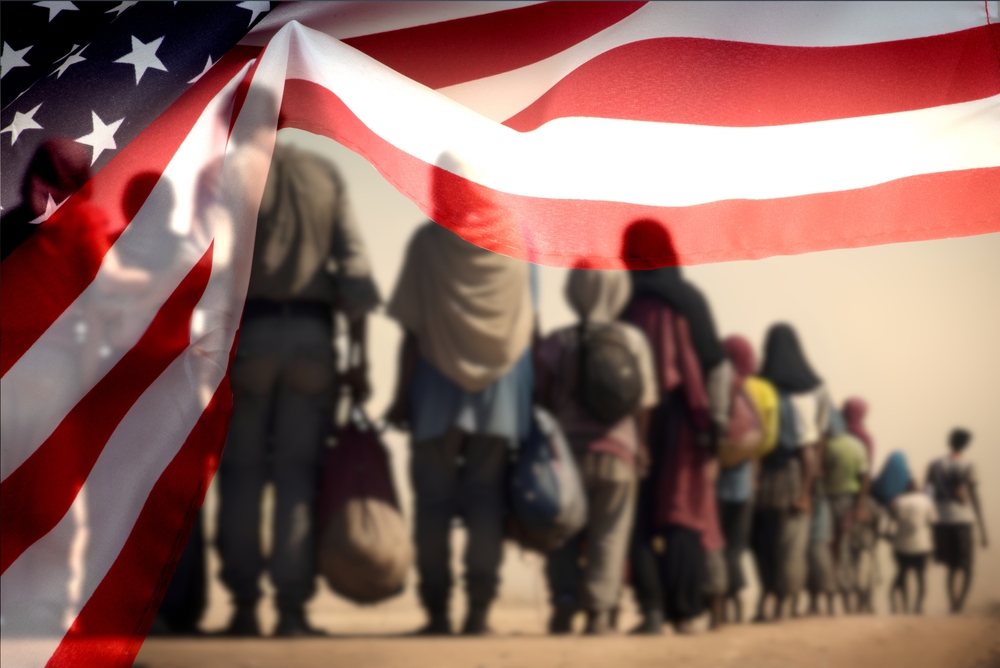 A,Group,Of,Migrants,And,Flag,Of,Usa