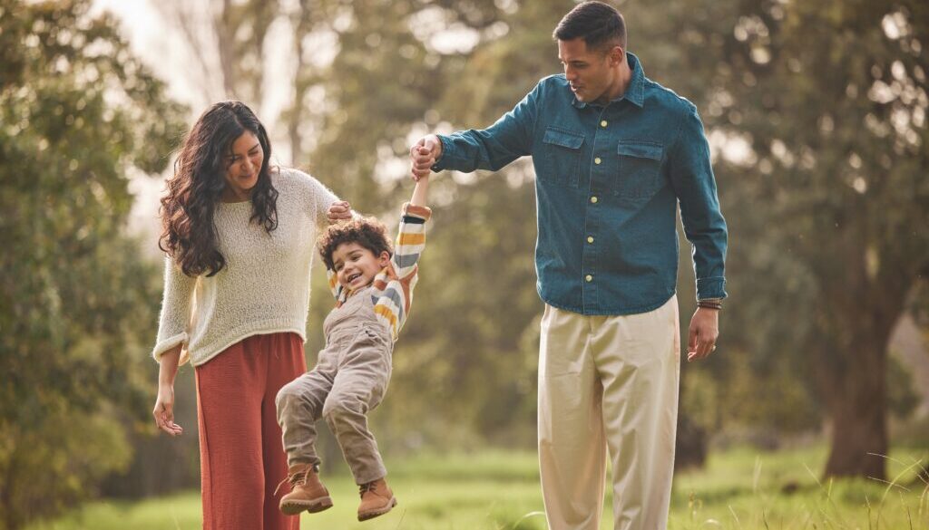 Holding,Hands,,Park,And,Parents,Play,With,Kid,In,Nature